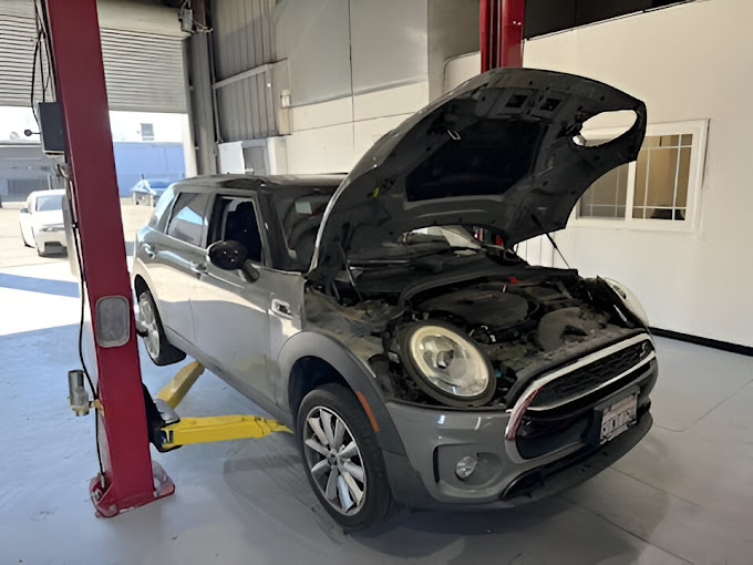 A car is being worked on in a garage