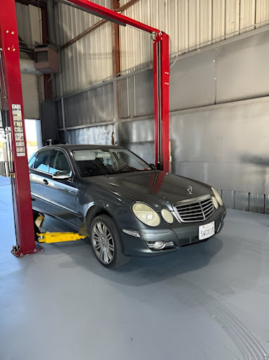 A car is parked inside of a garage